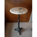 A SMALL VICTORIAN STYLE CAST IRON TABLE with a rouge marble top