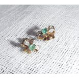 A PAIR OF 9CT YELLOW GOLD EMERALD DIAMOND BOW EARSTUDS