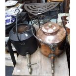 AN IRON TRIVET OF UNUSUAL DESIGN, a large 19th century copper kettle, with iron swing-handle and