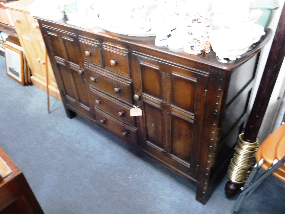 A DARK STAINED ERCOL SIDEBOARD