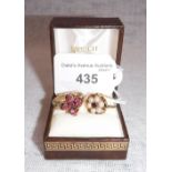 A RUBY FLOWERHEAD CLUSTER RING, to a 9ct yellow gold shank and a garnet and cultured peal ring (2)