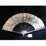 A 19TH CENTURY IVORY FAN with decorated leaf