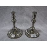 A PAIR OF 18TH CENTURY PEWTER CANDLESTICKS on splayed bases and knop stems