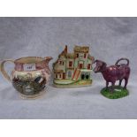 A LUSTRE MUG 'Crimea' a lustre glazed cow creamer and a Staffordshire Cottage