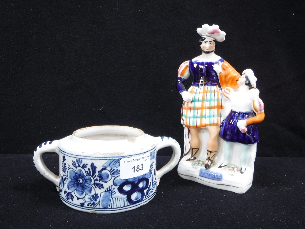 A DELFT TWO HANDLED BOWL and a Staffordshire figure of William Tell