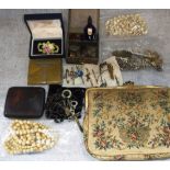 A COLLECTION OF SILVER AND COSTUME JEWELLERY and an evening purse