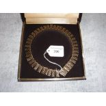 A 9CT GOLD OPENWORK NECKLACE in a fitted presentation case