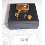 AN 'AMBER' BROOCH and a pair of 'amber' earstuds