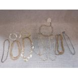 A COLLECTION OF CRYSTAL AND RELATED PEARL NECKLACES