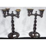 A LATE 19TH/EARLY 20TH CENTURY OAK FOUR BRANCH CANDLESTICK with a twisted support and brass drip-