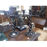 A PAIR OF 1920S OAK CANDELABRA with barley-twist supports, 13.5" high