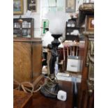 A REPRODUCTION ART NOUVEAU BRONZE EFFECT RESIN TABLE LAMP in the form of a woman, with a frosted