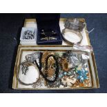 A COLLECTION OF VINTAGE COSTUME JEWELLERY including brooches, three white metal bangles and other