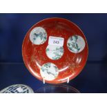 A CHINESE EXPORT PORCELAIN DISH with three circular reserves painted with landscape decoration on