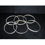 SIX VINTAGE SILVER BANGLES