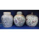 THREE CHINESE PORCELAIN GINGER JAR AND COVERS, each decorated with polychrome painted or blue floral