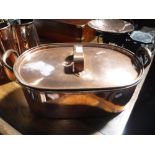 A 19TH CENTURY COPPER FISH KETTLE with original interior fitting and lid, 21" wide (including