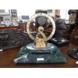 DEVON CLOCKS LTD: A LIMITED EDITION MANTEL CLOCK with a gilt metal 'Mermaid' support on a green