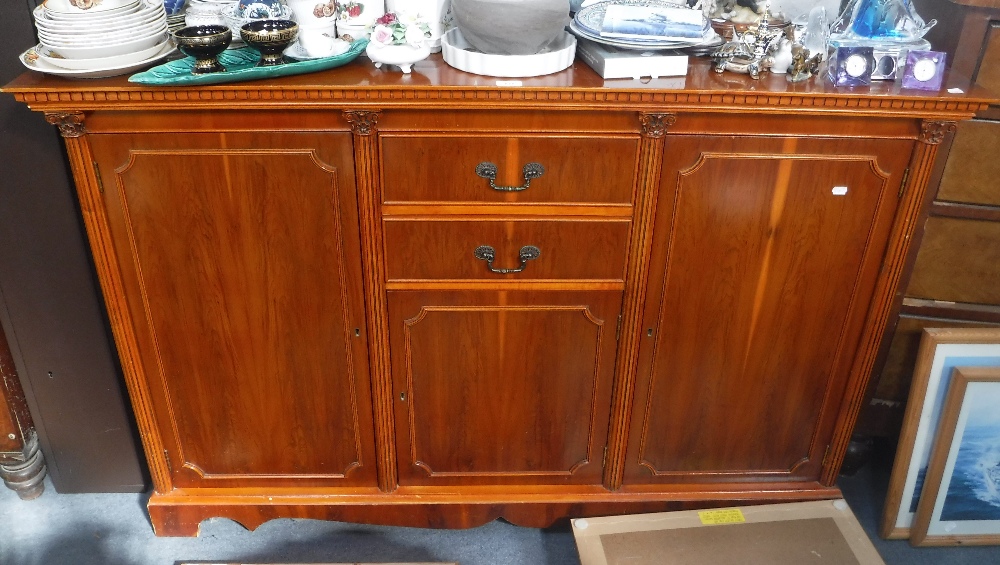 A REPRODUCTION YEW WOOD SIDEBOARD with column decoration, 60" wide