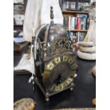 A BRASS LANTERN CLOCK by 'Smiths,' 10" high