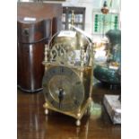 A BRASS LANTERN CLOCK by 'Smiths', 10" high