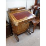 A LATE VICTORIAN WALNUT DAVENPORT with inlaid decoration