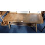 ERCOL: A PALE ELM COFFEE TABLE with magazine undertier, 41" long