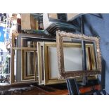 A COLLECTION OF PICTURE FRAMES including gilt examples and a Victorian maple frame