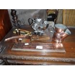 A 19TH CENTURY SILVER PLATED CORNUCOPIA SHAVING MUG, another in copper, two copper crumb trays and a