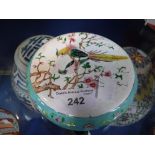 A CHINESE CANTON ENAMEL CIRCULAR BOX AND COVER, painted with a pair of pheasants perched in plume