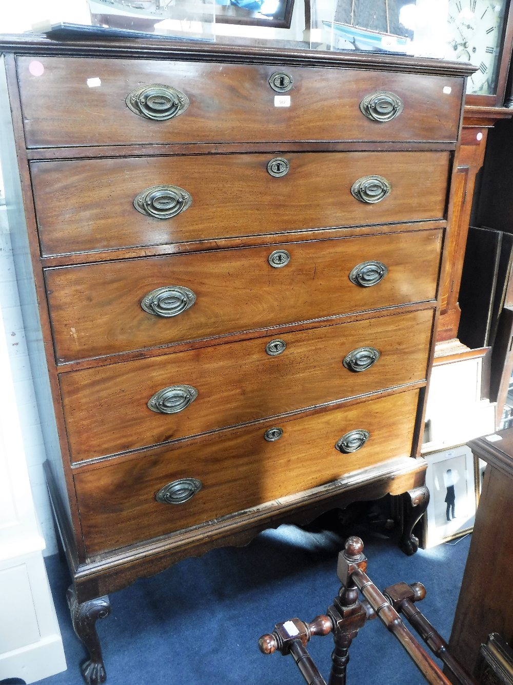 A 19TH CENTURY MAHOGANY CHEST OF FIVE DRAWERS on short cabriole legs, 45" wide