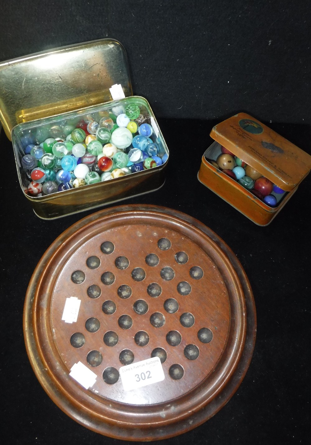 A COLLECTION OF VICTORIAN AND OTHER GLASS MARBLES, a Victorian mahogany Solitaire board and other