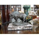 A BRONZE STUDY OF A BISON marked 'Aleksander', on a rouge marble base, 6.5" high