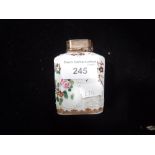 A SAMPSON PORCELAIN TEA CADDY with a silver plated cover and polychrome painted flower and