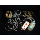 A COLLECTION OF VINTAGE METAL BANGLES