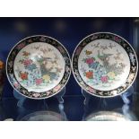 A PAIR OF JAPANESE CHARGERS, painted in enamels with tropical bird and flower decoration, within a