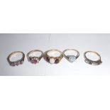 A COLLECTION OF FIVE 9CT YELLOW GOLD DRESS RINGS set with pink, white and blue stones