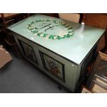 A LARGE PAINTED TOY TRUNK with panelled front, 24" deep x 48" wide