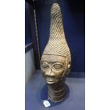 A NIGERIAN 'IFE' BRONZE SCULPTURE OF A HEAD in the antique style, 22" high
