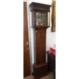 AN EARLY 18TH CENTURY OAK LONGCASE CLOCK with brass dial, thirty-hour movement inscribed with the