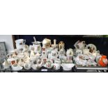 A LARGE COLLECTION OF CRESTED CHINA, to include a Vintage car and two related books