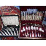 A SET OF SILVER PLATED KNIVES AND FORKS and one other silver plated canteen of cutlery in an oak