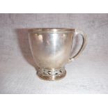 A 1930'S SILVER CUP with a pierced band of grapevines engraved with initials by 'Mappin & Webb',