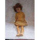 A VICTORIAN SPECIAL 65 PORCELAIN HEAD DOLL with an articulated composite body wearing a dress and