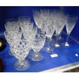 A SET OF TWELVE GLASS FLUTES and various other glassware including Stewart Crystal glasses