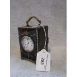 AN EDWARDIAN SILVER AND TORTOISESHELL SMALL CARRIAGE CLOCK/TIMEPIECE with inlaid music trophies