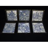 A SET OF SIX BLUE AND WHITE TILES, with scenes after Mediaeval woodcuts, in ebonised frames