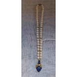 A CULTURED PEARL NECKLACE with 18ct yellow gold clasp, blue stone and diamond detail to the