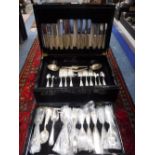 A CANTEEN OF SHEFFIELD SILVER PLATED CUTLERY contained in a lacquered case