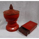 A BURMESE RED LACQUERED LIDDED VESSEL, 17" high and a similar red leather container, fitted a drawer